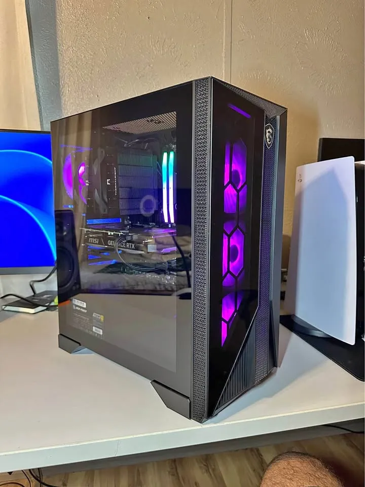 A black MSI gaming PC with purple fans and an RTX graphics card